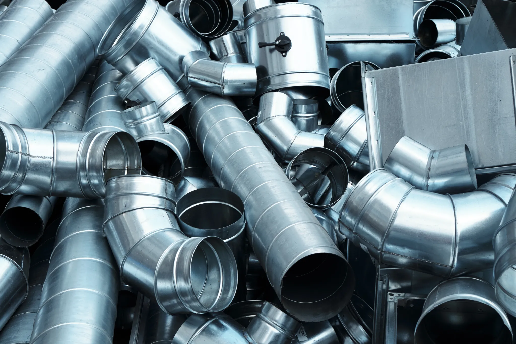 pile-of-pipes-and-parts-for-duct-systems-industri-2025-01-29-03-25-13-utc